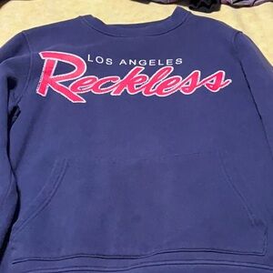 Young and reckless sweatshirt w a pocket on front